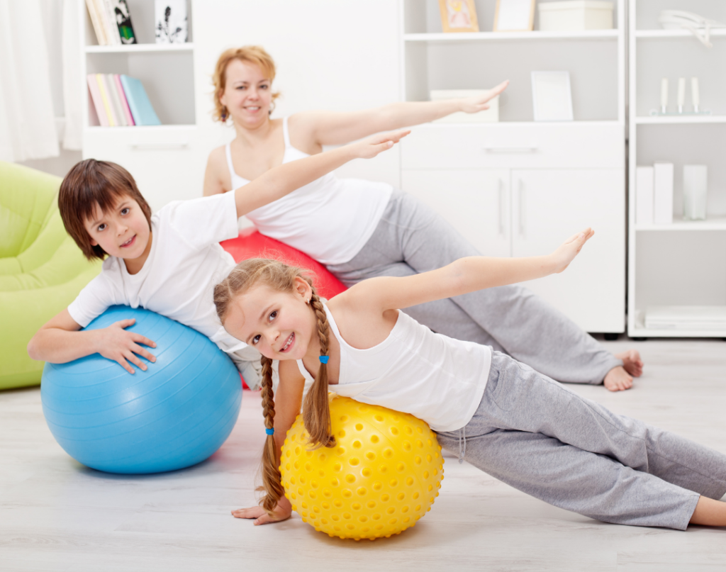 Children using yoga balls to improve gross motor skills