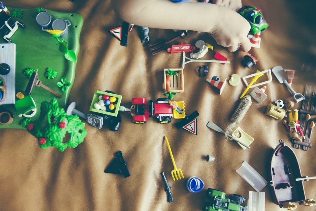 Child Playing with Farm Toys