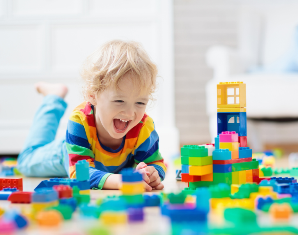 child playing with toys on the floor