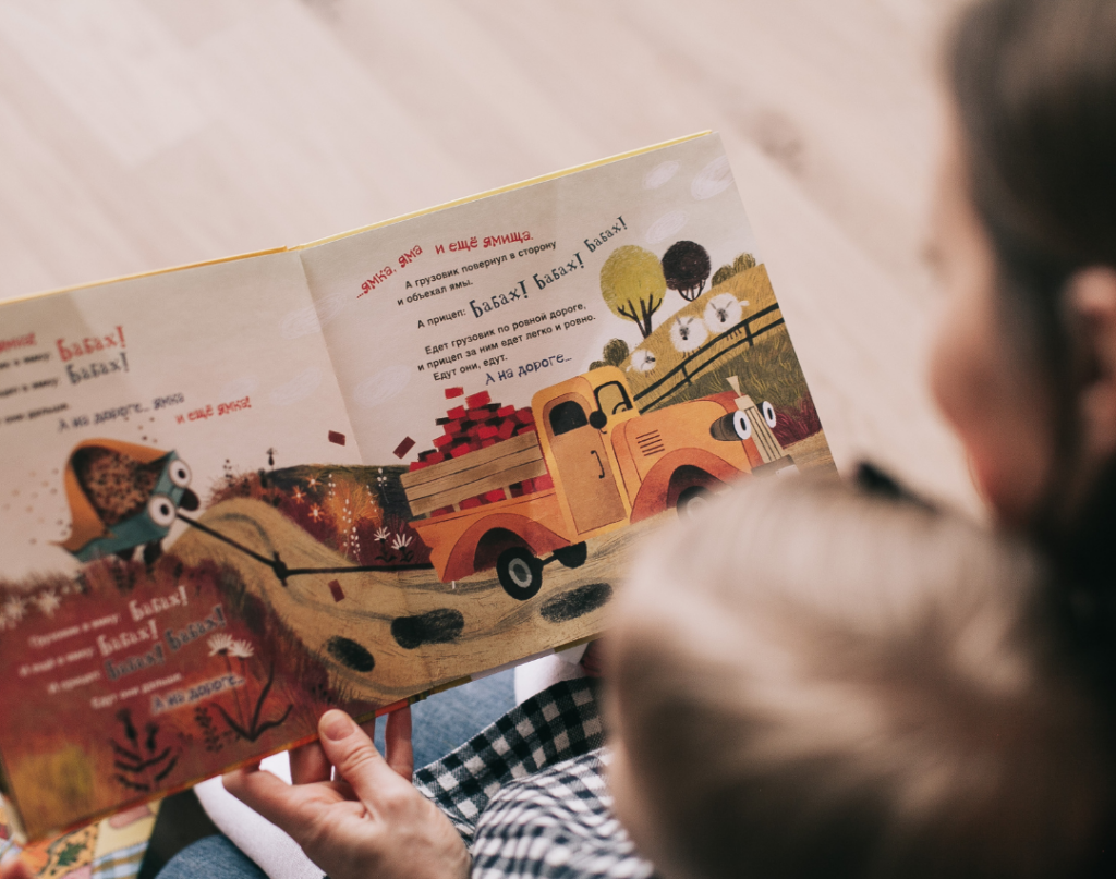 family reading picture book