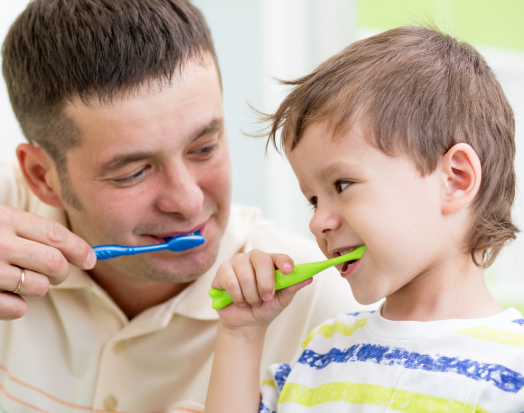 family working on language while brushing teeth