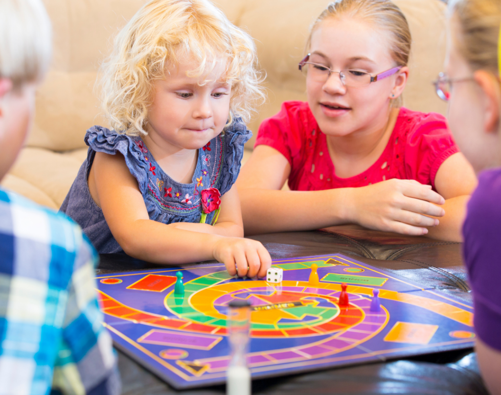 family playing board game