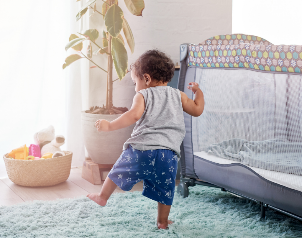 baby standing and walking independently