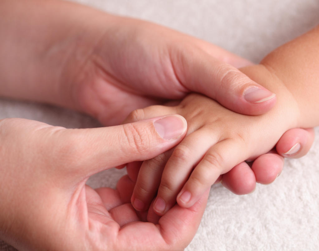 Child receiving hand massage