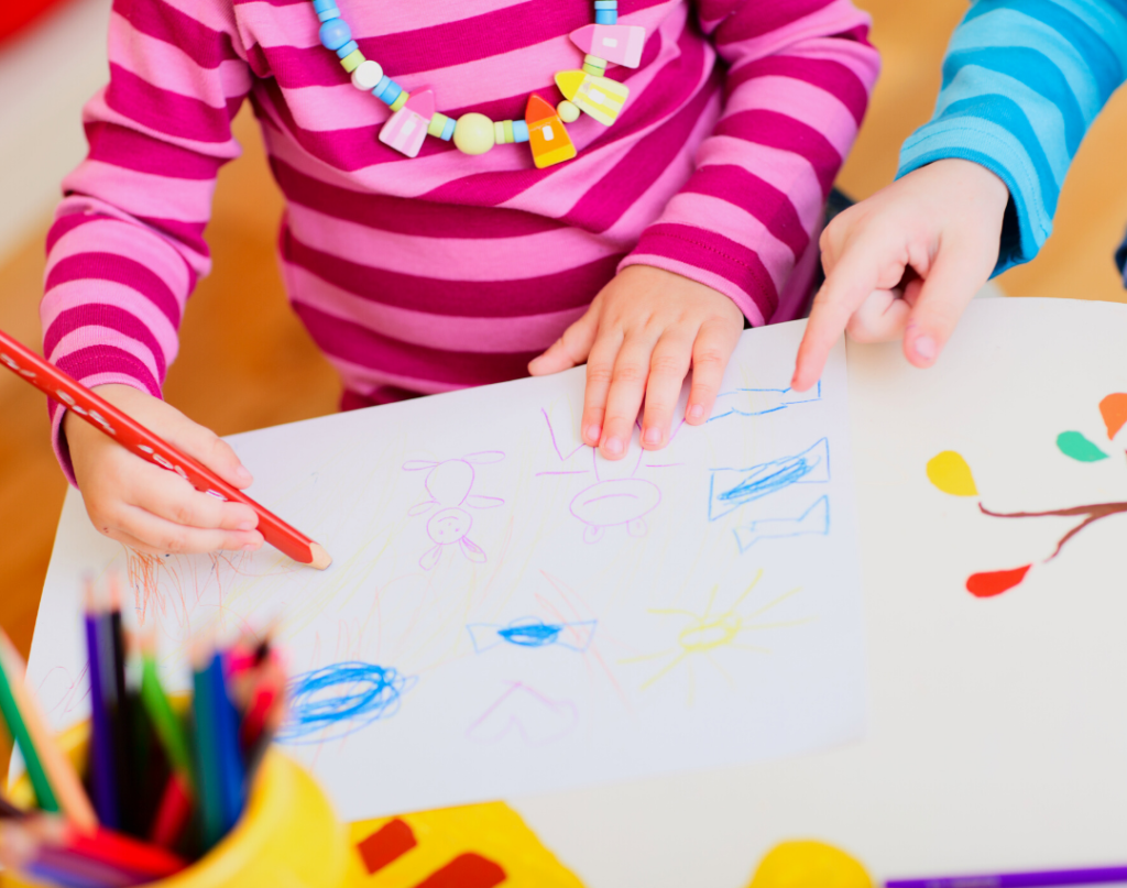 child practicing pre-writing strokes