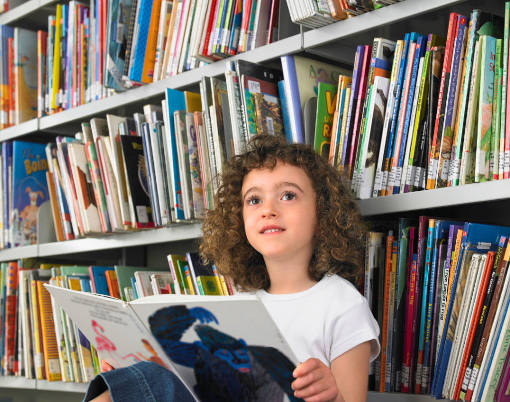 child reading at library