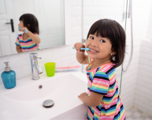 child brushing teeth
