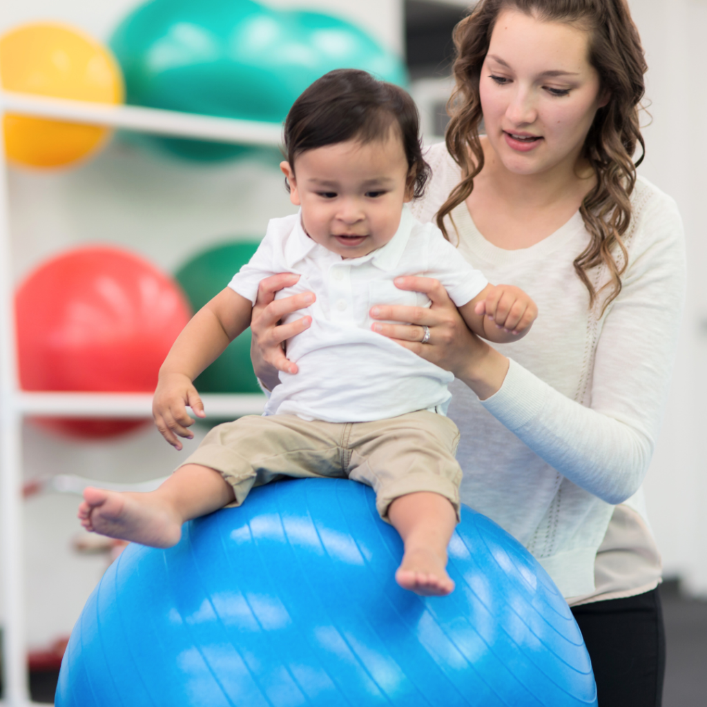 baby in physical therapy session working on balance