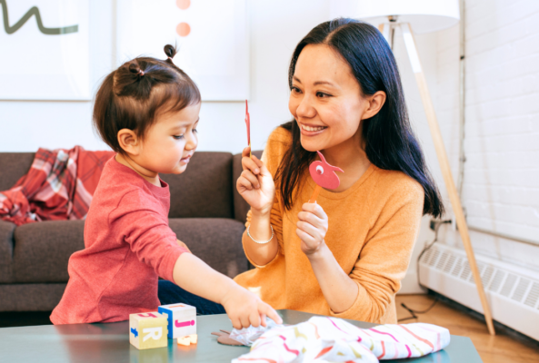 parent working with child on speech therapy