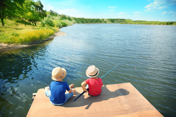 kids practicing healthy summer habits while fishing